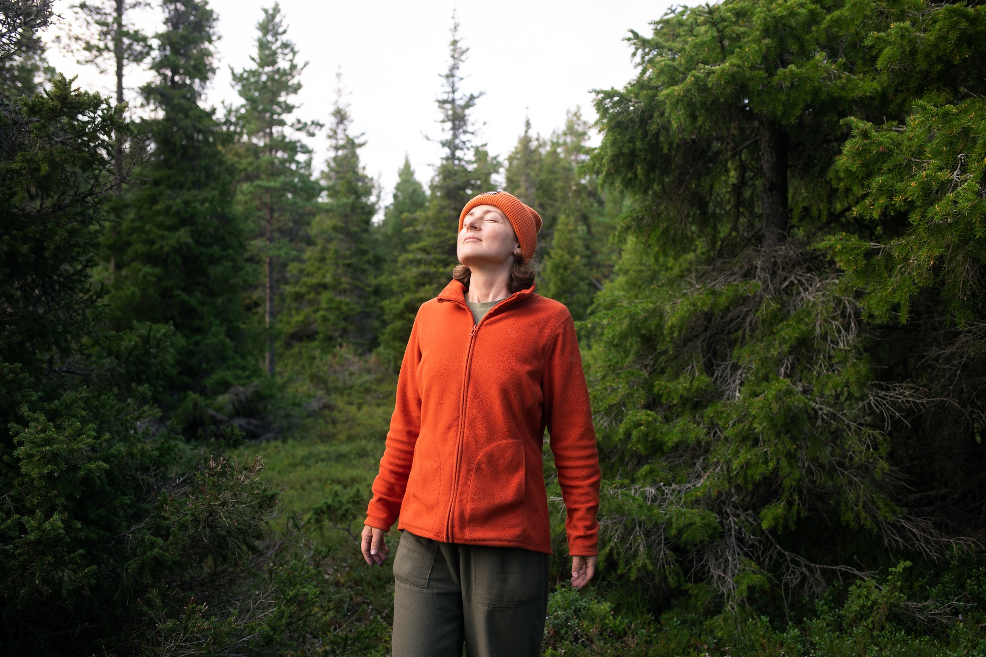 girl woman walking in nature park forest and breathing fresh air. concept of breathing, inhaling
